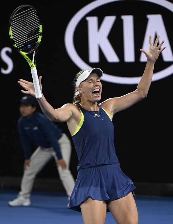 Denmark's&nbsp;Caroline&nbsp;Wozniacki&nbsp;celebrates after defeating Romania's Simona Halep during the women's singles final at the Australian Open tennis championships in Melbourne.