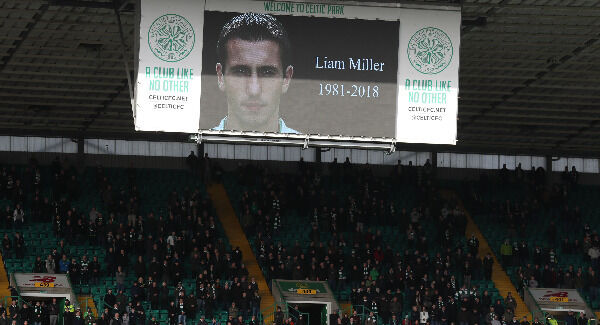Fans stand for a minute's silence in memory of Liam Miller at Celtic Park. Photo: Andrew Milligan/PA
