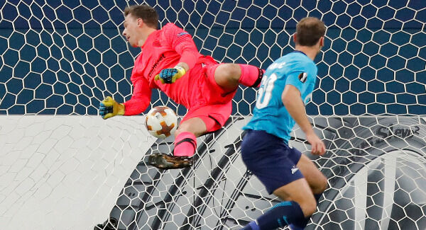 Zenit's Branislav Ivanovic, right, scores his side's first goal. Pic: AP Photo/Pavel Golovkin