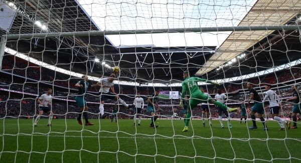 Tottenham Hotspur’s Harry Kane (second left) scores his side’s first goal, creating history. Picture: Steven Paston/PA Wire.