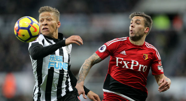 Newcastle United's Dwight Gayle and Watford's Kiko Femenia battle for the ball at St James' Park. Photo: Owen Humphreys/PA
