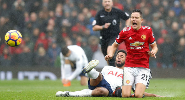 Manchester United's Ander Herrera and Tottenham Hotspur's Mousa Dembele battle for the ball at Old Trafford. Photo: Martin Rickett/PA
