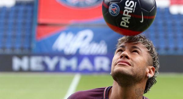 Neymar performs skills pitchside after a press conference at the Parc des Princes. Photo: Jonathan Brady/PA