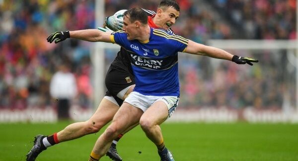 Mayo's Jason Doherty runs past Kerry's Mark Griffin last Sunday. Pic: Sportsfile.