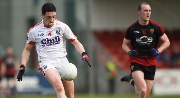 Micheal McSweeney of Cork in action against Shay Millar of Down during the Allianz Football League Division 2 Round 2 match between Down and Cork at Páirc Esler, in Newry, Down.