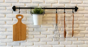 Making the most of storage space can require some lateral thinking and vertical planning — like these kitchen utensils and a plant hanging on a rail. Making the most of storage space can require some lateral thinking and vertical planning — like these kitchen utensils and a plant hanging on a rail.