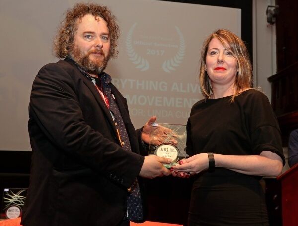 Festival senior programmer Don O&rsquo;Mahony presents &lsquo;Everything Alive is in Movement&rsquo; director Linda Curtin with the award for Best Cork Short.