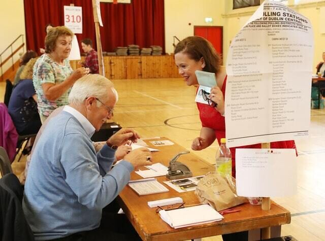 Sinn Fein leader Mary Lou McDonald presents her identity documents at St Joseph&rsquo;s School, Dublin (Niall Carson/PA)