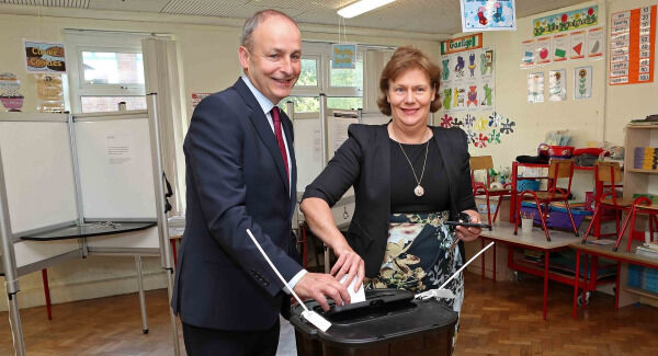 Micheàl Martin TD and his wife Mary at the polling station at St. Anthony's Boys NS, Ballinlough, Cork. Pic: Jim Coughlan