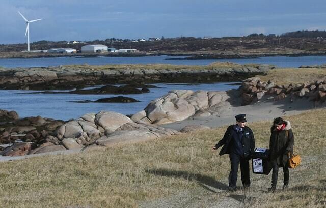 A ballot box is carried on Inishfree Island off the coast of Co Donegal ahead of a previous poll (Brian Lawless/PA)