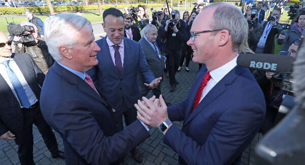 Minister Simon Coveney (right) greets the EU's chief Brexit negotiator Michel Barnier as they arrive at the All-Island Civic Dialogue conference on Brexit, at the Dundalk Institute of Technology. Pic: Niall Carson/PA Wire