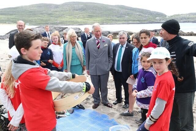 The royal couple and Irish government minister Kevin ‘Boxer’ Moran meet local schoolchildren taking part in a project to clear up about plastic pollution (Niall Carson/PA) The royal couple and Irish government minister Kevin ‘Boxer’ Moran meet local schoolchildren taking part in a project to clear up about plastic pollution (Niall Carson/PA)