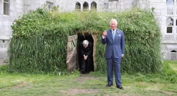 Pictured in UCC in Cork today is Prince Charles with Professor Patrick O'Shea, President of UCC. They are leaving a bothan, a one-roomed hut which was used by large sections of the population during the famine.