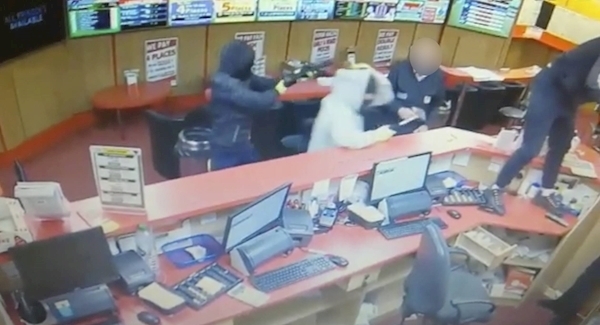 Watch: Elderly customer and staff member fight off armed raiders at Cork bookies