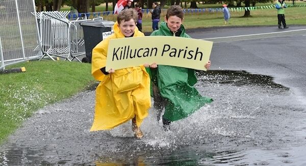 Jack Heffernan and Josh McGuerin, West Meath running through the water on their way to see Pope Francis saying mass at Phoenix Park, Dublin. Picture Dan Linehan
