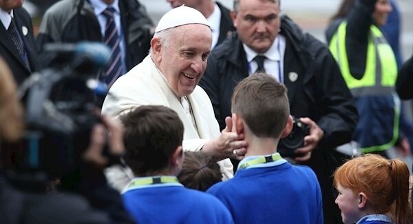 Pope Francis blesses schoolchildren as he arrives at Knock Aiport. Photo: Yui Mok/PA Wire