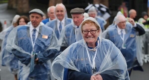 Pilgrims arrive at Knock well prepared for the rain. Photo: Niall Carson/PA Wire