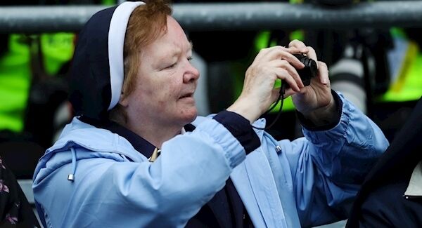 A member of the crowd pictured as Pope Francis makes his way through the crowd at Croke Park, Dublin