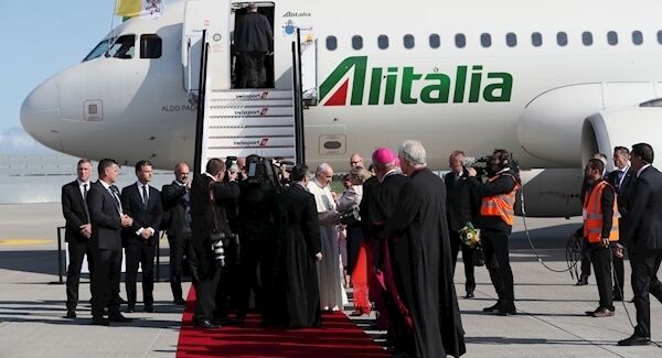 Pope Francis is greeted by members of the clergy, representatives of Government and the local County Council, as he arrives at Dublin International Airport, at the start of his visit to Ireland. (Brian Lawless/PA)