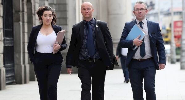 Ciaran MacAirt (centre) along with solicitors Rosie Kinnear and Niall O Murchu at the High Court today Ciaran MacAirt (centre) along with solicitors Rosie Kinnear and Niall O Murchu at the High Court today