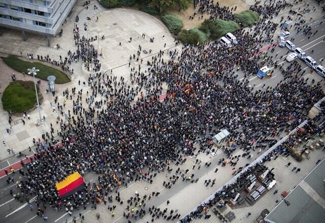 Police cars stand across the road as police separate leftist and nationalist demonstrators in Chemnitz (dpa/AP)