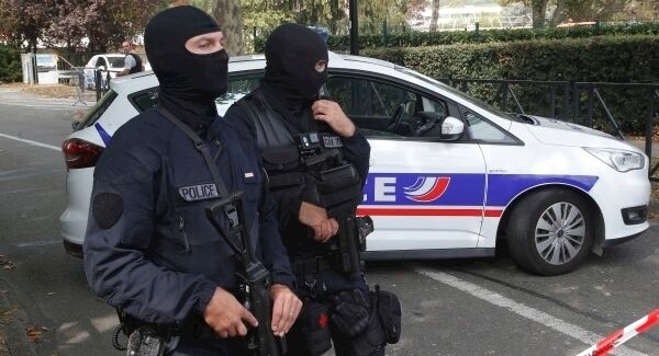 French police at the scene of a knife attack in the suburb of Trappes, west of Paris. Pic: AP