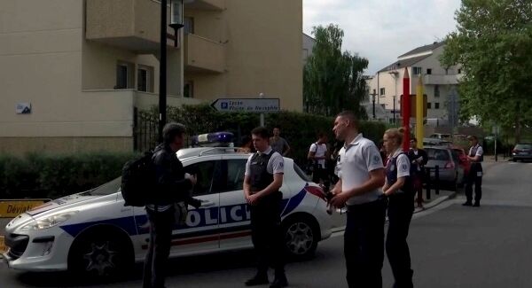 French police at the scene of a knife attack in the suburb of Trappes, west of Paris. Pic: AP