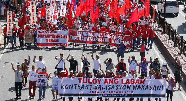 Protesters, mostly workers march towards the Presidential Palace during the global commemoration of Labor Day in Manila, Philippines. Pic: AP Photo/Bullit Marquez Protesters, mostly workers march towards the Presidential Palace during the global commemoration of Labor Day in Manila, Philippines. Pic: AP Photo/Bullit Marquez