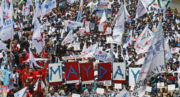 Indonesian workers shout slogans during a May Day rally in Jakarta, Indonesia. Pic: AP Photo/Achmad Ibrahim Indonesian workers shout slogans during a May Day rally in Jakarta, Indonesia. Pic: AP Photo/Achmad Ibrahim