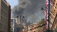Dozens of firefighters tackle huge blaze at luxury London hotel