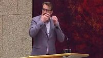 Man jumps from public gallery of Dutch parliament in attempt to hang himself
