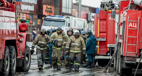 A group of firefighters walk near the scene. Photos: AP Photo
