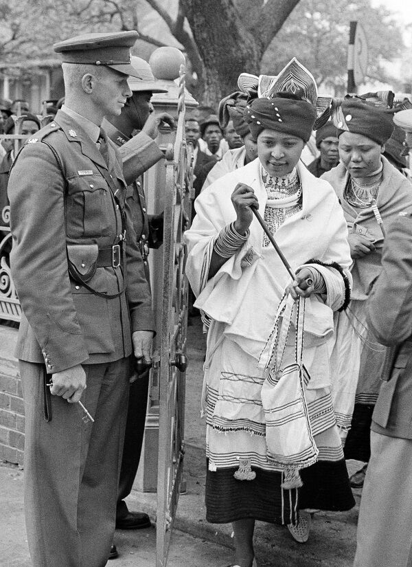Winnie Mandela, wife of the African National Congress (ANC) leader Nelson Mandela, wears traditional dress as she and two other women attend her husband's trial in Pretoria, South Africa.