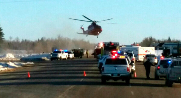 Emergency crews responding to the scene. Photo: 650 CKOM/980 CJME via AP.