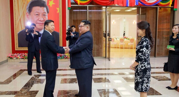 Ri Sol Ju (right) with her husband Kim Jong Un meeting Song Tao, front left, head of the ruling Communist Party's International Department this month.
