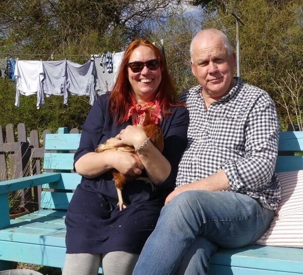 Alice Hatfield and Darrah Mayne with their hen, Mano.
