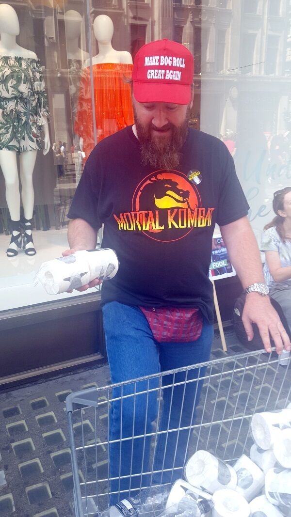 James O'Brien sells Donald Trump toilet paper, as part of the protests against the visit of US President Donald Trump to the UK. Photo: Catherine Wylie/PA Wire