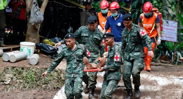 Military personnel perform a rescue drill next to the cave entrance.  Rungroj Yongrit/EPA