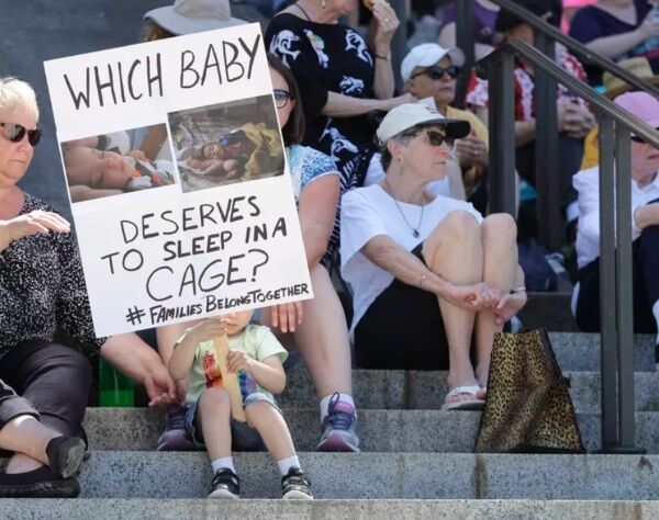 Christopher Baker, 3, holds a sign that reads ‘Which baby deserves to sleep in a cage?’ as he attends a Poor People’s Campaign rally with his mother in Olympia, Wash., on June 18. (AP Photo/Ted S. Warren) Christopher Baker, 3, holds a sign that reads ‘Which baby deserves to sleep in a cage?’ as he attends a Poor People’s Campaign rally with his mother in Olympia, Wash., on June 18. (AP Photo/Ted S. Warren)