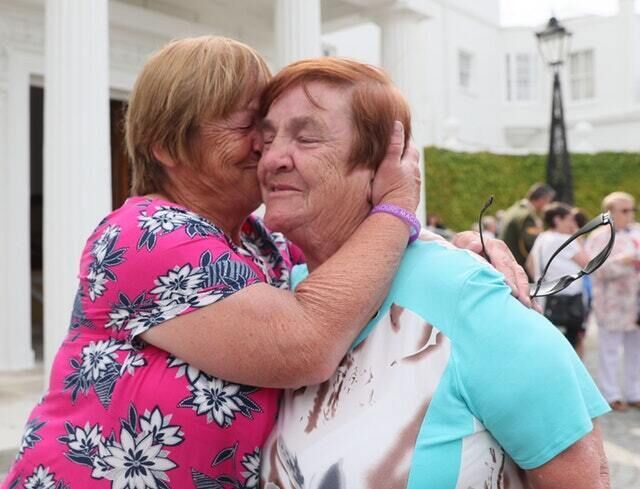 Twin sisters Mairead Manley (left) and Breda Kennedy, survivors of the Goldenbridge Magdalene laundry attend a reception hosted by president Michael D Higgins at Aras an Uachtarain (Brian Lawless/PA)