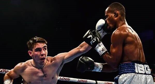 Michael Conlan plants a straight on the nose of Adeilson Dos Santos during their super featherweight bout in Belfast. Picture: Ramsey Cardy