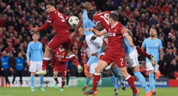 Sadio Mane (centre) scores his side's third goal of the game. Pic: PA.