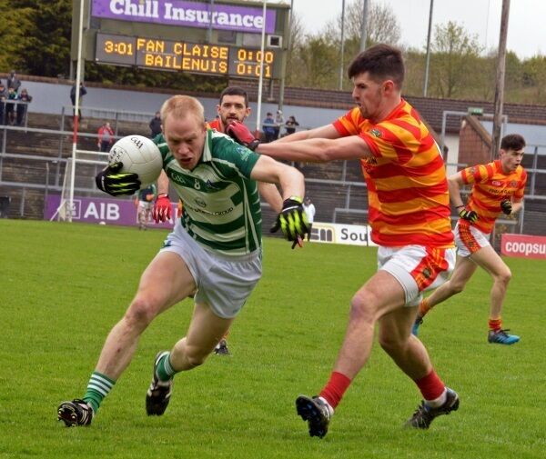Kevin Canty holding off Trevor Horgan. Picture Denis Boyle