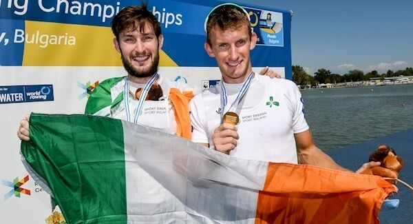 Paul and Gary O'Donovan celebrate with their gold medals. Photo: INPHO/Detlev Seyb