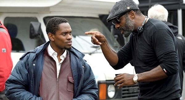 Idris Elba giving instructions to actor Aml Ameen on the set of Yardie. Picture: PA Photo/StudioCanal