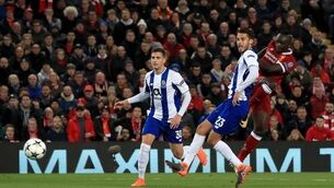 Liverpool ease into Champions League quarter-finals after tame scoreless draw