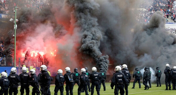 Hamburg fans throw fireworks. AP Photo/Michael Sohn Hamburg fans throw fireworks. AP Photo/Michael Sohn