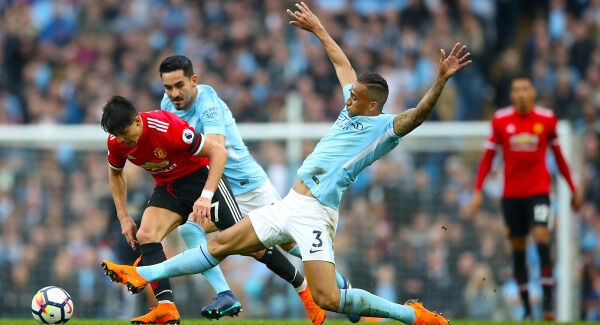 Manchester United's Alexis Sanchez and Manchester City's Danilo battle for the ball at the Etihad Stadium. Photo: Nick Potts/PA