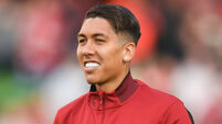 Firmino commits future to Liverpool with 'no-look' contract signing