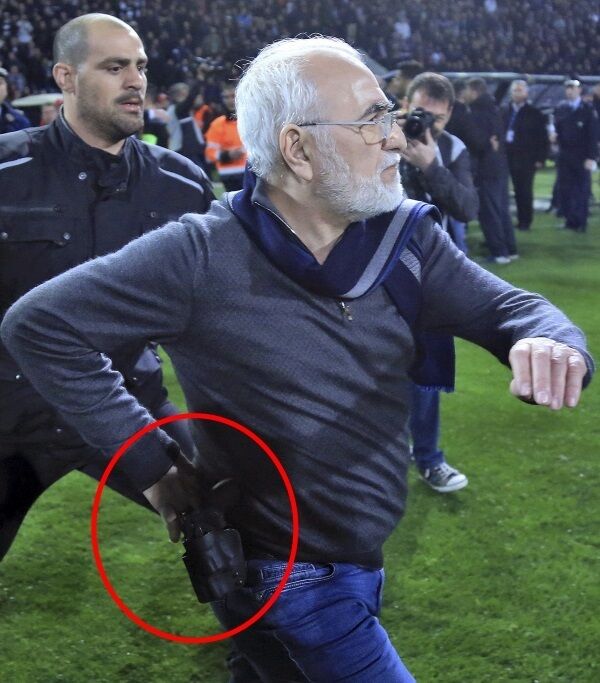 PAOK owner, businessman Ivan Savvidis invades into the pitch during a Greek League soccer match between PAOK and AEK Athens in the northern Greek city of Thessaloniki. InTime Sports via AP PAOK owner, businessman Ivan Savvidis invades into the pitch during a Greek League soccer match between PAOK and AEK Athens in the northern Greek city of Thessaloniki. InTime Sports via AP
